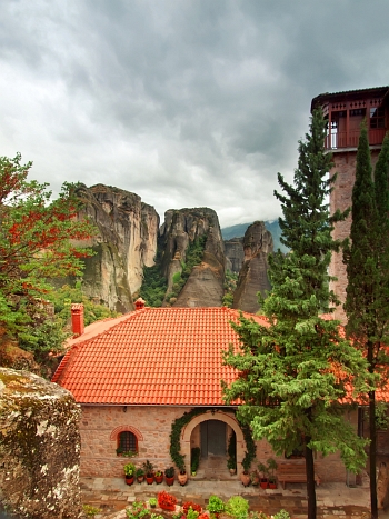 Beautiful colorful yard with flowers at Holy Monastery of Roussano, Meteora
