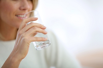 Woman drinking water from a glass