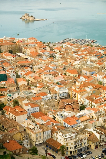 View of picturesque houses and Bourtzi Fort at the city of Nafplion