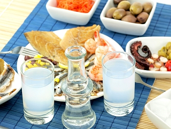 Greek dishes and traditional Greek drink named ouzo