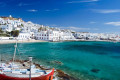 Tranquil bay in Mykonos, complete with fishing boats and crystal clear waters