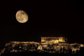 Under the guise of the moon, Acropolis casts is imposing look over the city