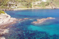 A bay with crystal clear waters near the village of Apollonas in Naxos