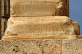 Ancient script on Poseidon Temple column on Cape Sounion, Attica region of Greece