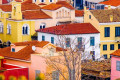 Colorful houses with ceramic rooftops in Plaka, Athens