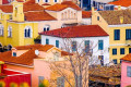 Colorful houses with ceramic rooftops in the historic Athenian neighborhood of Plaka