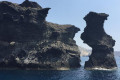 This giant rock pillar off the coast of Santorini is known as the Black Mountain
