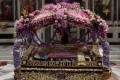 Epitaphios decorated in Easter with flowers and embroidered cloths