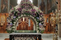 Epitaphios decorated in Easter with flowers and embroidered cloths