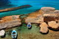 Fishing boats in Firiplaka beach, Milos island