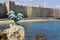 View of the main harbor of Rhodes and the 3 dolphins statue