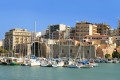 Port with ships and houses in Heraklion city, Crete island