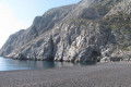 The beach of Kamari in Santorini is favored by anyone wishing to avoid the swarming crowds