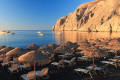 Kamari beach in Santorini offers magnificent views of the Aegean Sea and warm waters most of the year