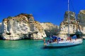 Ship sailing in the turquoise waters of Kleftiko area, Milos island