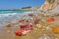 View of the colorful volcanic rocks and the golden sand of exotic Firiplaka beach, Milos island