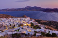 Panorama of Plaka village and the tranquil sea at sunset, Milos island