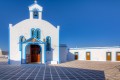 White and blue traditional Greek Orthodox church Agia Paraskevi in Pollonia village, Milos island