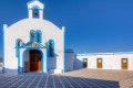 White and blue traditional Greek Orthodox church Agia Paraskevi in Pollonia village, Milos island