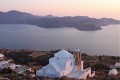 Elevated view of Milols island, traditional church and the peaceful sea at sunset