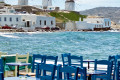 Seaside tavern and the famous windmills, Mykonos island