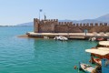 Beautiful fishing village of Nafpaktos and colorful traditional boats at its picturesque port