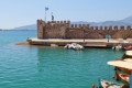 Fishing port with traditional boats in the village of Nafpaktos, West Greece