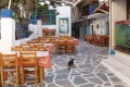 Slated island street and traditional tavern tables, Naxos island
