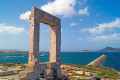 The Portara Gate of Naxos can be seen on the island's coast as you approach the main port