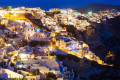 The village of Oia beautifully illuminated at night