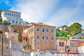 Beautiful old buildings in Hydra denote the island's unique architectural blends