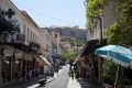 Walking on the beautiful streets of Plaka with a view to Acropolis Hill and the famous Parthenon Temple, Athens
