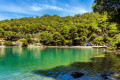 Blue-green waters on the coast of Poros