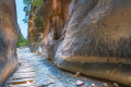 Hiking trail next to a stream in the gorge of Samaria in Crete