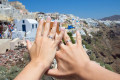 Celebrating your love in Santorini with the town of Fira laid out before you