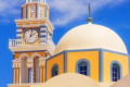 Vivid colors of elaborate church domes in Fira town, Santorini island