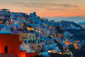 The Santorinian village of Oia, as the night falls on the island