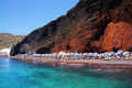 Red beach against the turquoise waters, Santorini island