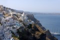 Sugar cubed houses perched on the volcanic cliffs going down the caldera, Santorini island