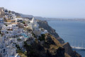 Sugar cubed houses perched on the volcanic cliffs going down the caldera, Santorini island