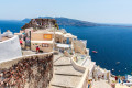 Concrete staircases leading down to the beautiful caldera bay in Fira Town, Santorini island