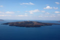 The volcanic islet of Nea Kameni across from Santorini