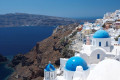 The village of Oia, perched on the cliff, overlooking the caldera
