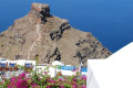 Rock pillar on the edge of the Santorinian coast near Imerovigli with a view to the caldera