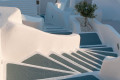Whitewashed stairs in Imerovigli, leading to traditional cafes and bistros