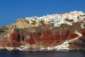 Approaching the port of Santorini as Fira watches from the cliff above