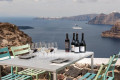 Drinking wine with a view of the Santorinian caldera