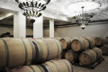 Wine aging in oak barrels in a vineyard in Nemea