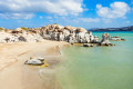 The serene waters contrast with a wild rocks on the beach of Kolymbithres to create a wonderful scenery