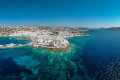 Deep blue waters a rocky coast in this aerial picture of Mykonos